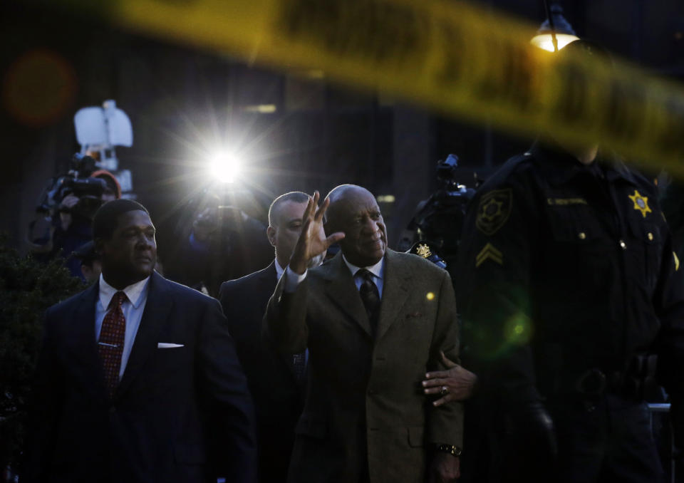 FILE - In this Feb. 2, 2016, file photo, Bill Cosby waves to cheering fans as he leaves after a court appearance in Norristown, Pa. Cosby was convicted of sexual assault in 2018. He is serving up to 10 years in prison. Now in the midst of another historic reckoning, this time addressing the treatment of African Americans and other people of color by police and the criminal justice system, the 82-year-old Cosby has won the right to an appeal. (AP Photo/Mel Evans)