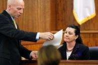 Assistant district attorney William McCauley (L), questions witness Jodi Webb (R), an FBI geologic forensic examiner, during the murder trial for former New England Patriots football player Aaron Hernandezl in Fall River, Massachusetts March 26, 2015. REUTERS/Steven Senne/Pool