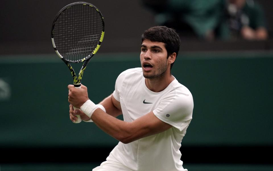 Carlos Alcaraz in action against Jeremy Chardy (not pictured) on day two of the 2023 Wimbledon Championships at the All England Lawn Tennis and Croquet Club in Wimbledon