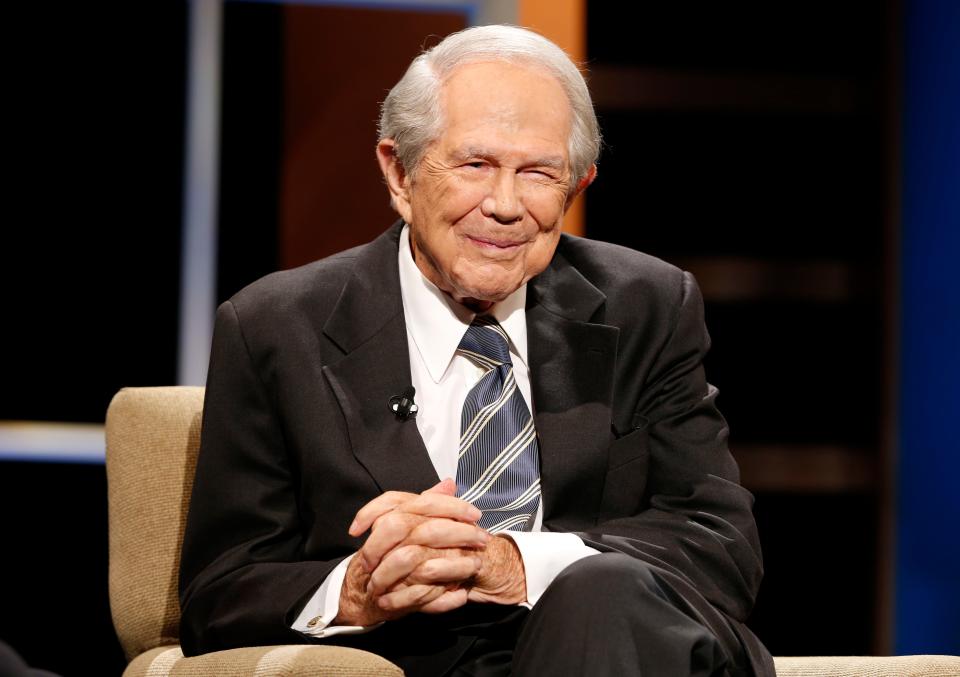 In this 2015 file photo, Rev. Pat Robertson poses a question to a Republican presidential candidate during a forum at Regent University in Virginia Beach, Va.