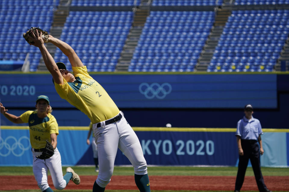 Australia's Clare Warwick (2) catches a fly ball hit by United States' Valerie Arioto for an out in the fourth inning of a softball game at the 2020 Summer Olympics, Sunday, July 25, 2021, in Yokohama, Japan. (AP Photo/Sue Ogrocki)