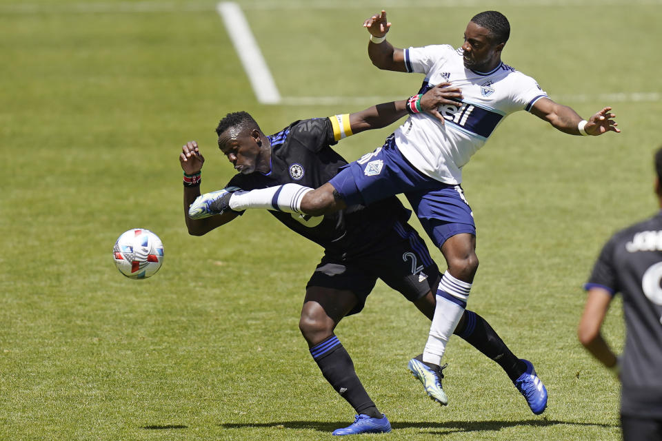 CF Montréal midfielder Victor Wanyama (2) and Vancouver Whitecaps forward Cristian Dajome, right, battle for the ball in the first half of an MLS soccer game Saturday, May 8, 2021, in Sandy, Utah. (AP Photo/Rick Bowmer)