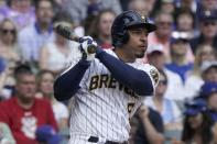 Milwaukee Brewers' Eduardo Escobar rhits an RBI double during the fifth inning of a baseball game against the Chicago Cubs Sunday, Sept. 19, 2021, in Milwaukee. (AP Photo/Morry Gash)