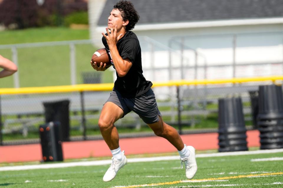 Brandon Giangeruso runs with the ball during practice at Whippany Park High School. Wednesday, July 12, 2023