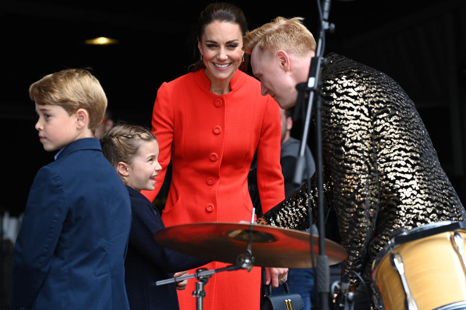 The Duchess of Cambridge, Prince George and Princess Charlotte meets a performer during their visit to Cardiff Castle to meet those involved in the special Platinum Jubilee Celebration Concert taking place in the castle grounds later in the afternoon, as members of the Royal Family visit the nations of the UK to celebrate Queen Elizabeth II's Platinum Jubilee. Picture date: Saturday June 4, 2022.