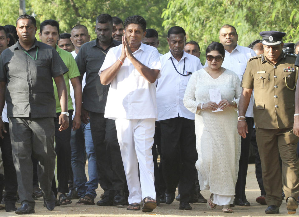 Presidential candidate of Sri Lanka's governing party Sajith Premadasa arrives to cast his vote at a polling station in Weerawila, Sri Lanka, Saturday, Nov. 16 , 2019. A convoy of buses carrying Muslim voters traveling in northern Sri Lanka was attacked by gunfire and stones, and blocked by burning tires, around midnight on Saturday hours before polls opened in Sri Lanka’s presidential election, according to Colombo-based Centre for Monitoring Election Violence. (AP Photo/Chamila Karunarathne )