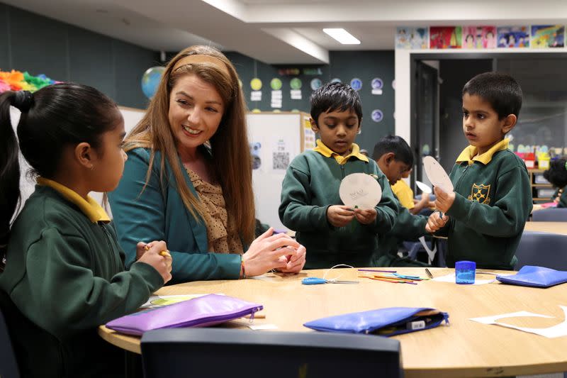 Children return to campus for the first day of New South Wales public schools fully re-opening in Sydney