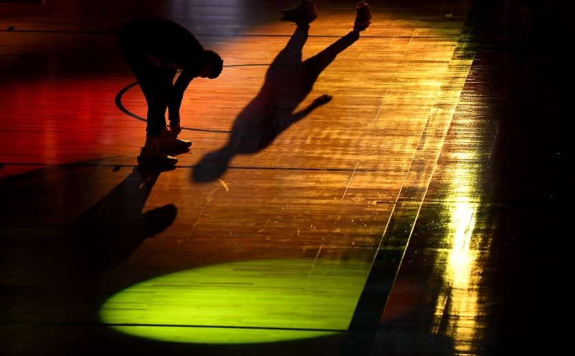 Lakers guard Danny Green adjusts his shoes before Game 3 of the NBA FInals.