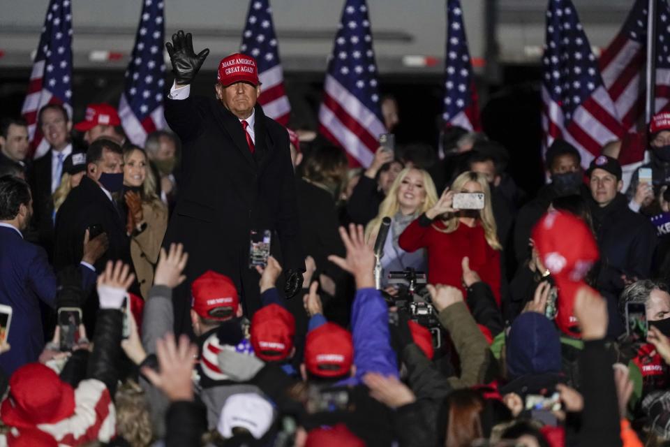 President Donald Trump waves to the crowd after speaking at a campaign event at the Kenosha Regional Airport Monday, Nov. 2, 2020, in Kenosha, Wis. (AP Photo/Morry Gash)