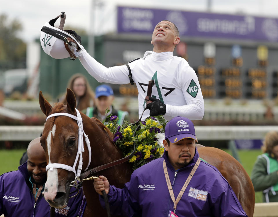 Javier Castellano celebrates after ridding Bulletin to victory in the Breeders' Cup Juvenile Turf Sprint horse race at Churchill Downs, Friday, Nov. 2, 2018, in Louisville, Ky. (AP Photo/Darron Cummings)