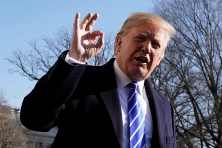 U.S. President Donald Trump gestures as he talks to the media on South Lawn of the White House in Washington, U.S., before his departure to Camp David, December 16, 2017. REUTERS/Yuri Gripas