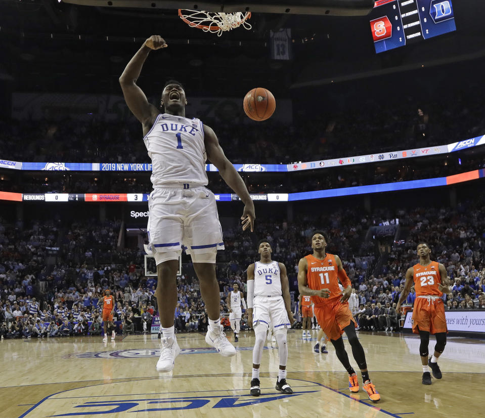 Duke's Zion Williamson (1) reacts after his dunk against Syracuse during the first half of an NCAA college basketball game in the Atlantic Coast Conference tournament in Charlotte, N.C., Thursday, March 14, 2019. (AP Photo/Chuck Burton)