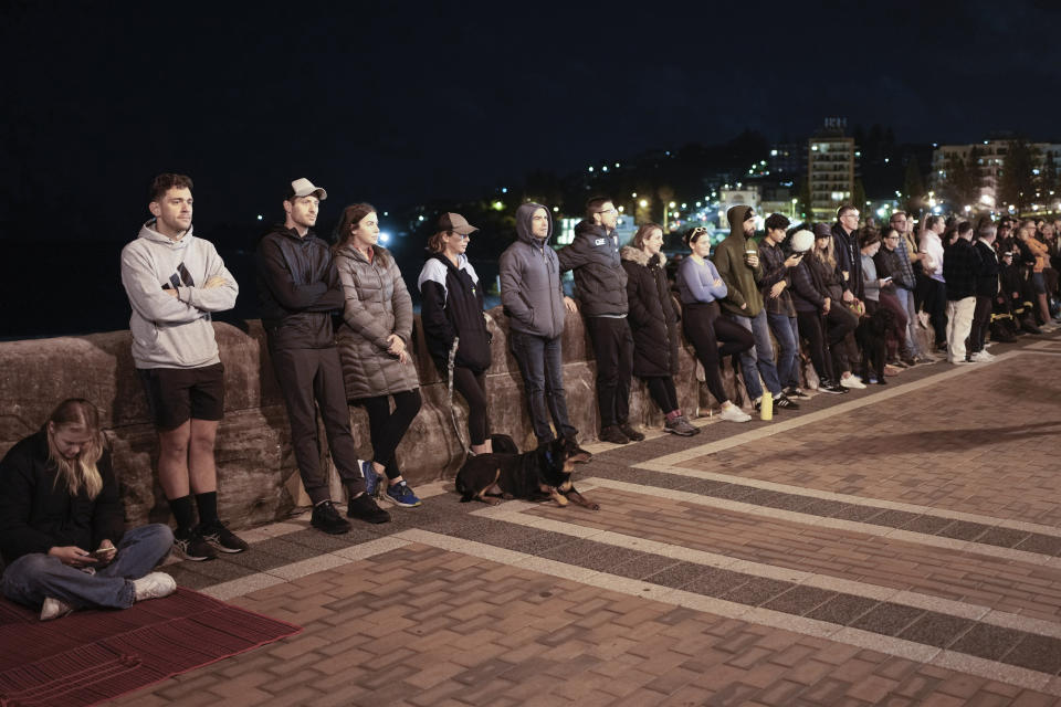 Crowds gather for the Anzac Day dawn service at Coogee Beach in Sydney, Australia, Thursday, April 25, 2024. (AP Photo/Mark Baker)