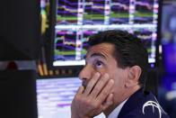 Specialist Peter Mazza works at his post on the floor of the New York Stock Exchange, Monday, Aug. 12, 2019. Stocks are extending their losses at midday as investors opened the week heading for safety amid heightened anxiety over the U.S.-China trade war. (AP Photo/Richard Drew)