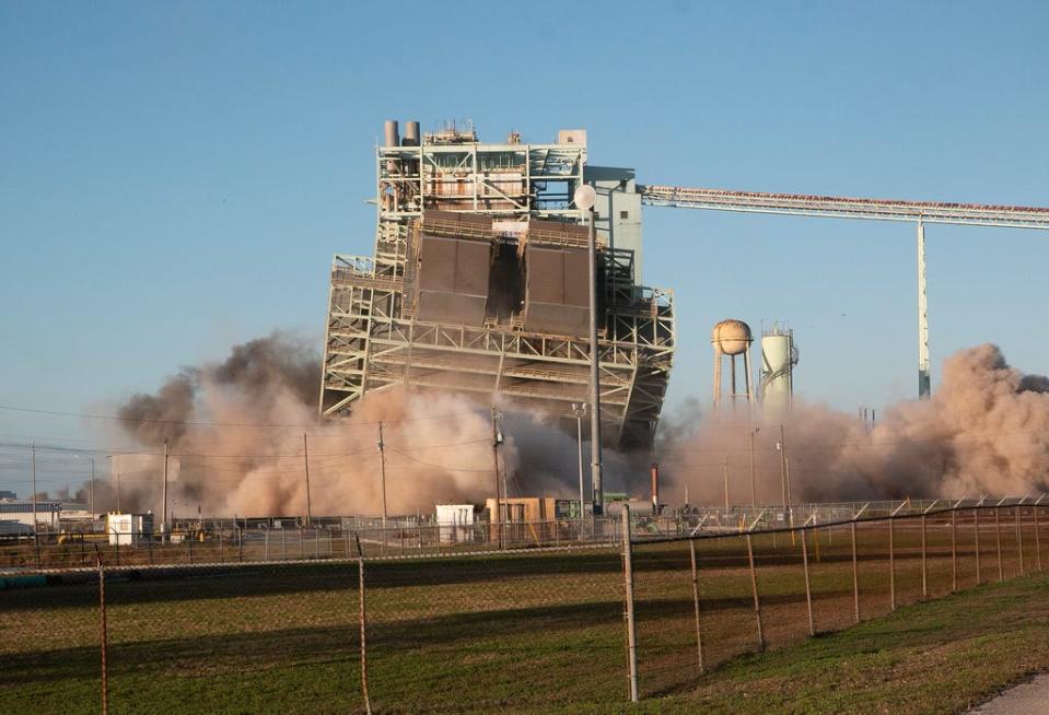 Lakeland Electric's Unit 3 at the McIntosh Power Plant is seen in a time lapse during the demolition and implosion of the structure Saturday morning.