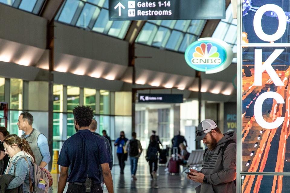 Passengers are shown waiting for flights in this recent photo taken at Will Rogers World Airport.