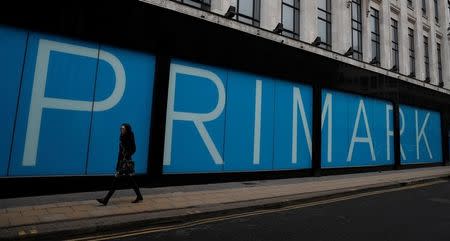 FILE PHOTO - A woman walks past a branch of Primark in Manchester, Britain, February 21, 2017. REUTERS/Phil Noble/File Photo