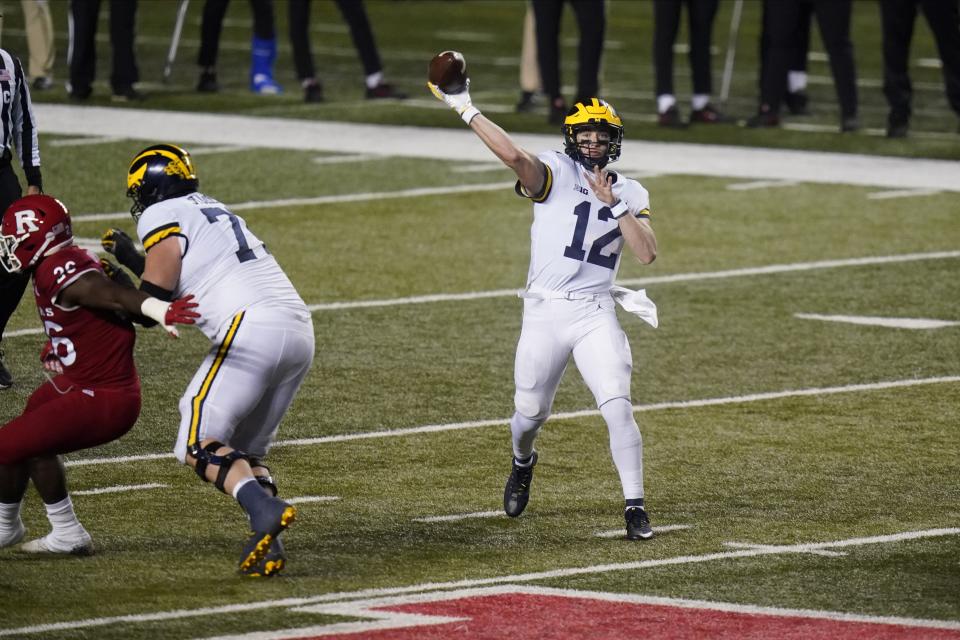 Michigan's Cade McNamara throws a pass during the second half of the team's NCAA college football game against Rutgers on Saturday, Nov. 21, 2020, in Piscataway, N.J. Michigan won 48-42. (AP Photo/Frank Franklin II)