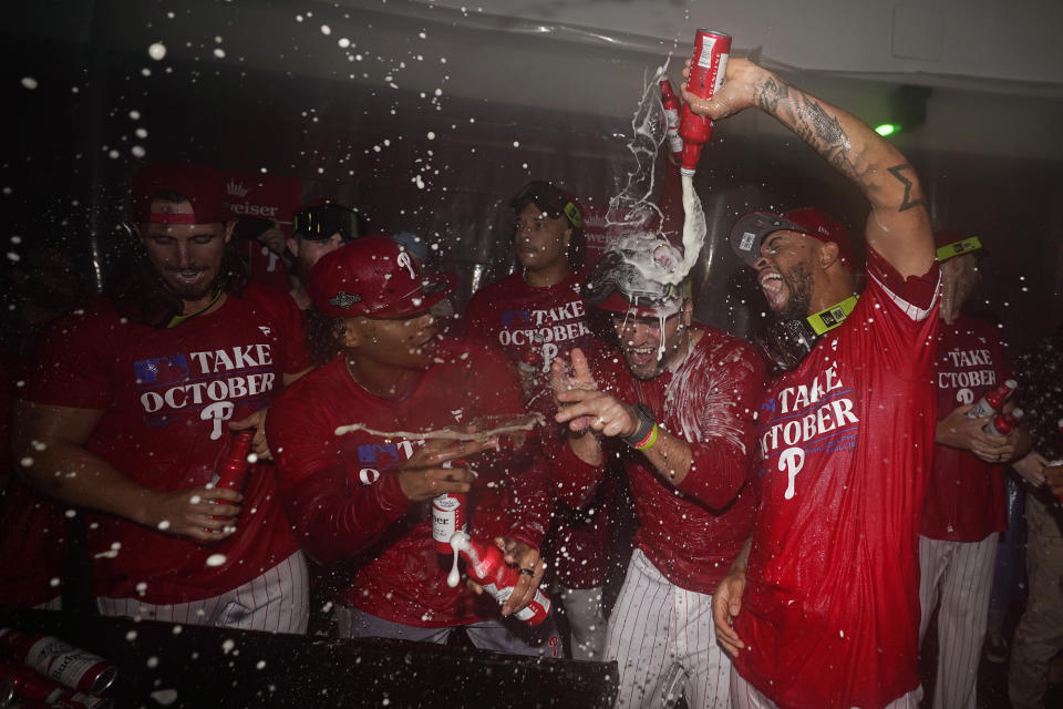 The Philadelphia Phillies celebrate after winning an NL wild-card baseball playoff series against the Miami Marlins, Wednesday, Oct. 4, 2023, in Philadelphia. (AP Photo/Matt Slocum)