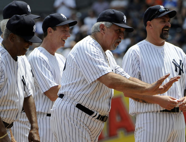 Former New York Yankees baseball first baseman Joe Pepitone, second from right, reacts during Old-Timers' Day ceremonies Sunday, June 26, 2011 at Yankee Stadium in New York. Pepitone, a key figure on the 1960s Yankees who gained reknown for his flamboyant personality, has died at age 82. He was living with his daughter Cara Pepitone at her house in Kansas City, Mo., and was found dead Monday, March 13, 2023, according to BJ Pepitone, a son of the former player. (AP Photo/Bill Kostroun, File)