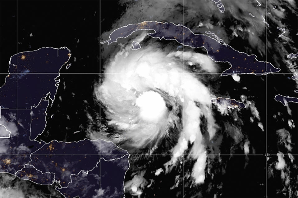 This satellite image provided by the National Oceanic and Atmospheric Administration shows Tropical Storm Ian over the central Caribbean on Monday, Sept. 26, 2022. (NOAA via AP)