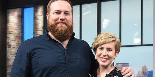 erin and ben napier smiling as they visit the set of people