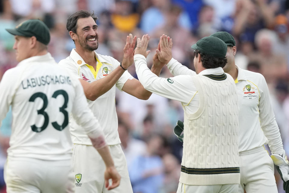 Australia's Mitchell Starc celebrates taking the wicket of England's Jonny Bairstow on day three of the fifth Ashes Test match between England and Australia, at The Oval cricket ground in London, Saturday, July 29, 2023. (AP Photo/Kirsty Wigglesworth)