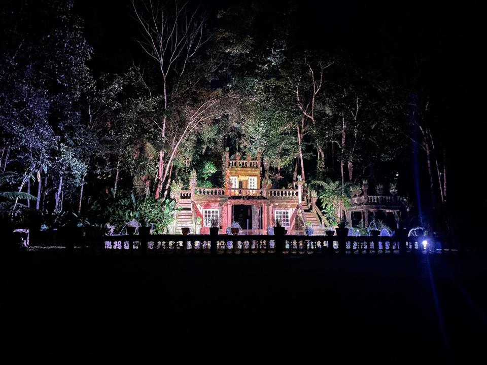 The main castle illuminated in lights.