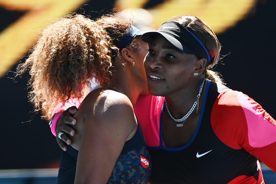 MELBOURNE, AUSTRALIA - FEBRUARY 18: Serena Williams of the United States (R) embraces Naomi Osaka of Japan following her defeat in their Women’s Singles Semifinals match during day 11 of the 2021 Australian Open at Melbourne Park on February 18, 2021 in Melbourne, Australia. (Photo by Quinn Rooney/Getty Images)