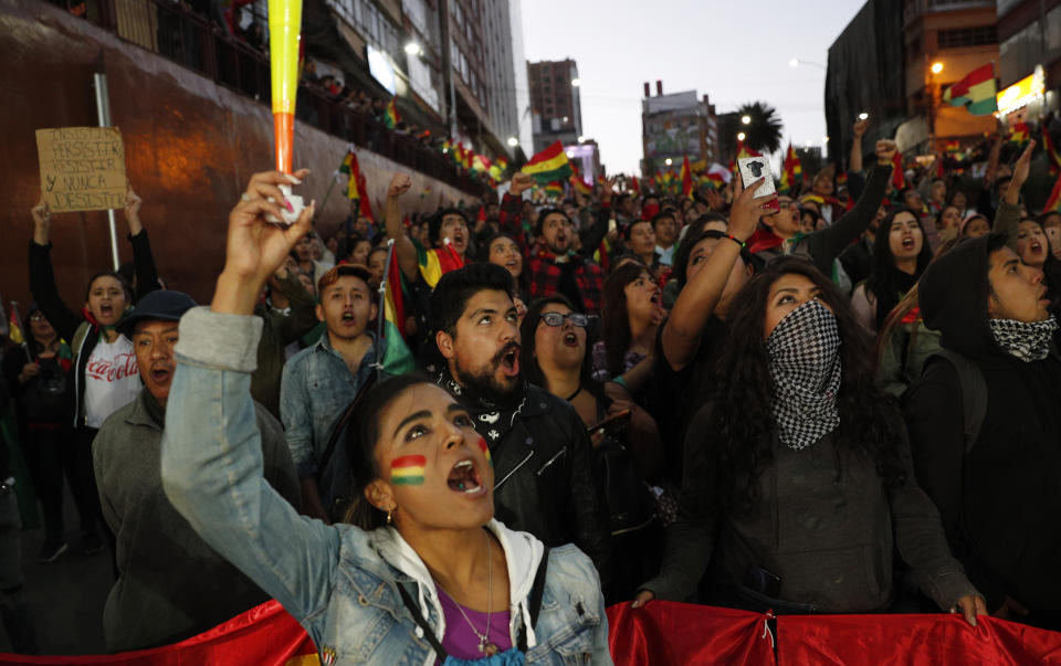 Anti-government protesters march demanding a second round presidential election in La Paz, Bolivia, Saturday, Oct. 26, 2019. Bolivia's official vote tally was revealed Friday pointing to an outright win for incumbent Evo Morales in a disputed presidential election that has triggered protests and growing international pressure on the Andean nation to hold a runoff ballot. (AP Photo/Juan Karita)