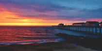 <p>The sky burns with bright colours as the sun rises over Southwold Pier. (Rex features)</p>