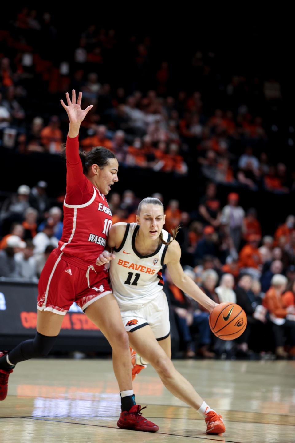 Oregon State guard AJ Marotte (11) drives to the basket against Eastern Washington guard Jacinta Buckley (10) during the first quarter at Gill Coliseum in Corvallis, Ore. on Thursday, Nov. 17, 2022.