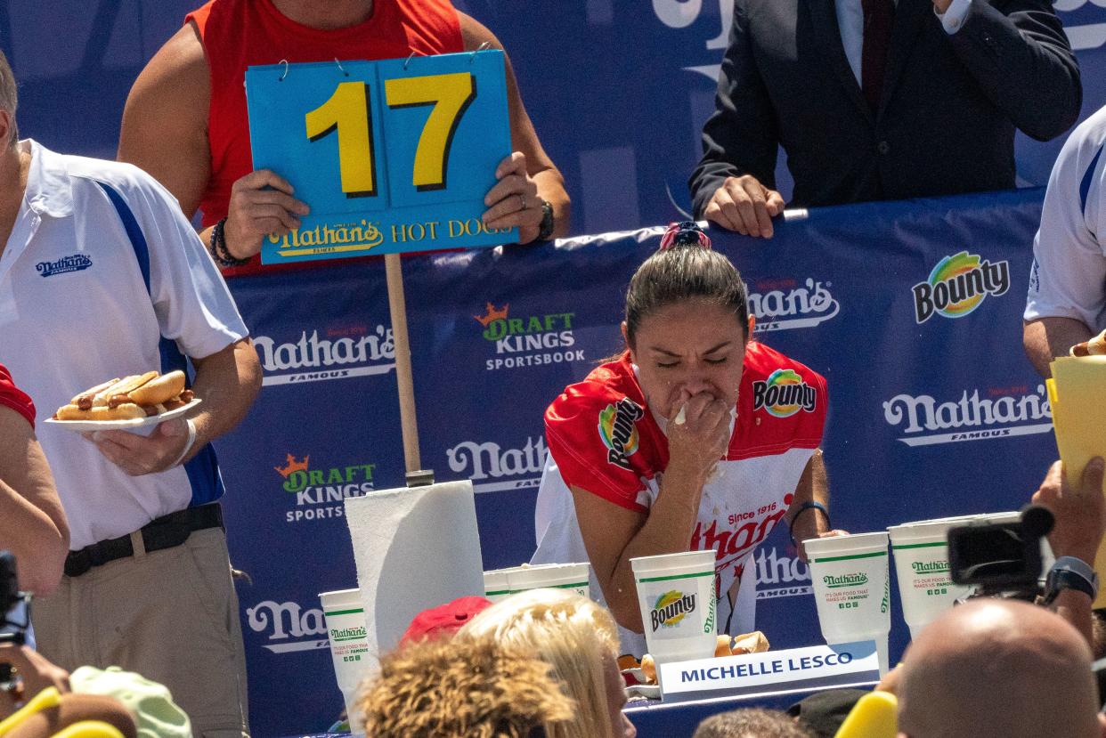Competitive eating champion Michelle Lesco wins the women's 2021 Nathan's Famous 4th Of July International Hot Dog Eating Contest with 31 hot dogs at Coney Island on July 4, 2021, in New York City.