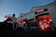 <p>Neon signs are seen at the entrance to God’s Own Junkyard gallery and cafe in London, Britain at dusk, May 13, 2017. (Photo: Russell Boyce/Reuters) </p>