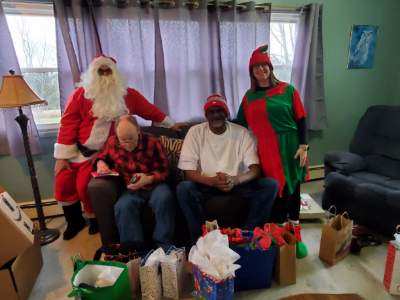 Santa and his helpers deliver goodies to residents at Hilltop Villa.