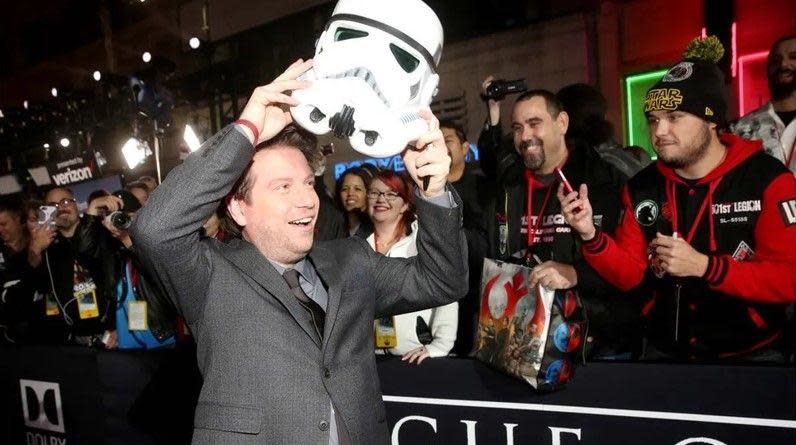 Gareth Edwards with stormtrooper helmet on the red carpet