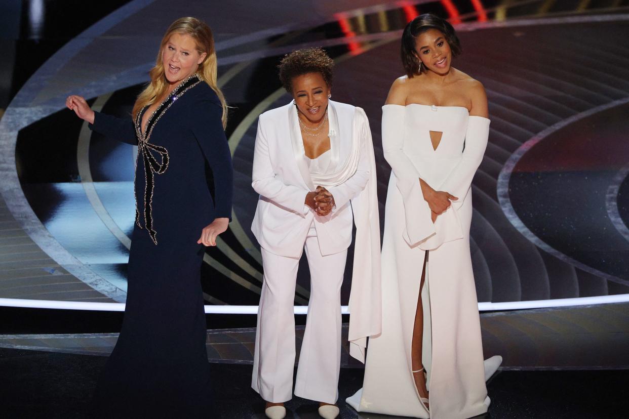 Amy Schumer, Wanda Sykes and Regina Hall on stage at the 2022 Oscars.
