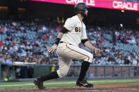 San Francisco Giants' Brandon Belt watches his RBI-double against the Arizona Diamondbacks during the third inning of a baseball game in San Francisco, Monday, June 14, 2021. (AP Photo/Jeff Chiu)