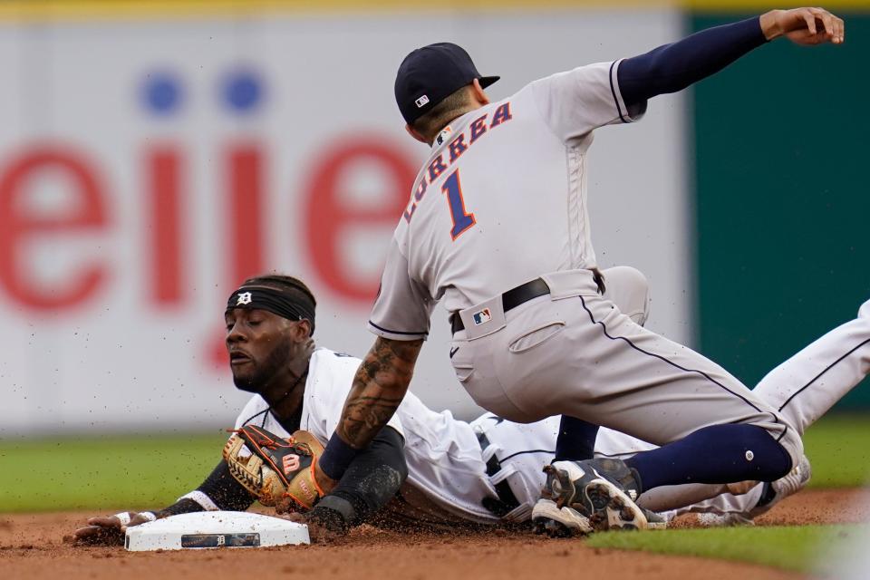Detroit Tigers' Akil Baddoo is tagged out attempting to steal second base by Houston Astros shortstop Carlos Correa (1) in the first inning of a baseball game in Detroit, Thursday, June 24, 2021.