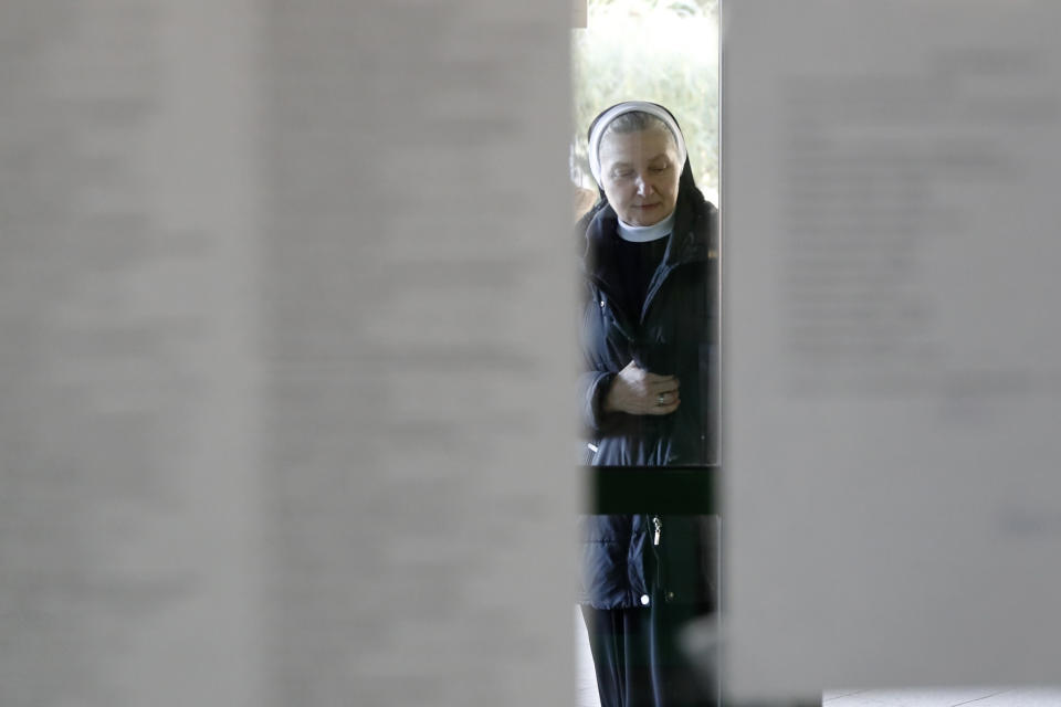 A catholic nun approaches polling station in Warsaw, Poland, Sunday, Oct. 13, 2019. Poles are voting Sunday in a parliamentary election, that the ruling party of Jaroslaw Kaczynski is favored to win easily, buoyed by the popularity of its social conservatism and generous social spending policies that have reduced poverty. (AP Photo/Darko Bandic)