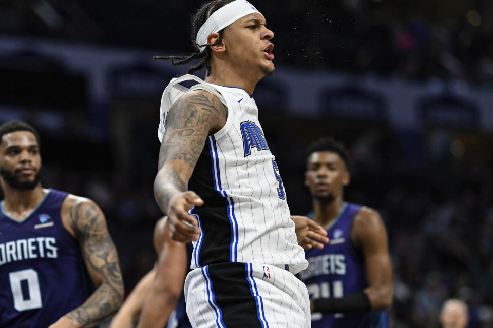 Orlando Magic forward Paolo Banchero (5) reacts during the second half of the team's NBA basketball game against the Charlotte Hornets, Tuesday, March 5, 2024, in Charlotte, N.C. (AP Photo/Matt Kelley)