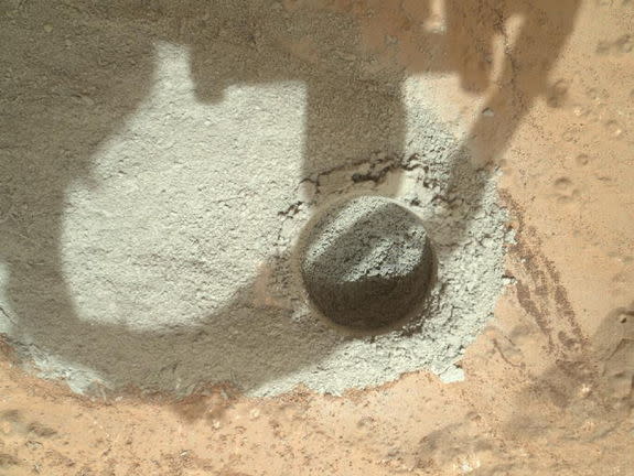 In an activity called the "mini drill test," NASA's Mars rover Curiosity used its drill to generate this ring of powdered rock for inspection in advance of the rover's first full drilling (Feb. 6, 2013). Image released Feb. 7, 2013.