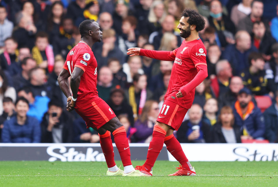 Liverpool's Sadio Mane (left) celebrates with teammate Mohamed Salah during the Premier League match between Watford and Liverpool.