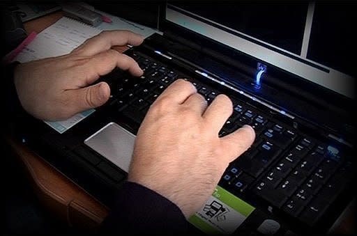 A photo made available by the Child Exploitation and Online Protection Centre shows a police officer tracking paedophile's on the Internet. Police in several countries have arrested 184 alleged members of an online paedophile ring and rescued 230 children in "the biggest case of its kind", Europol said on Wednesday