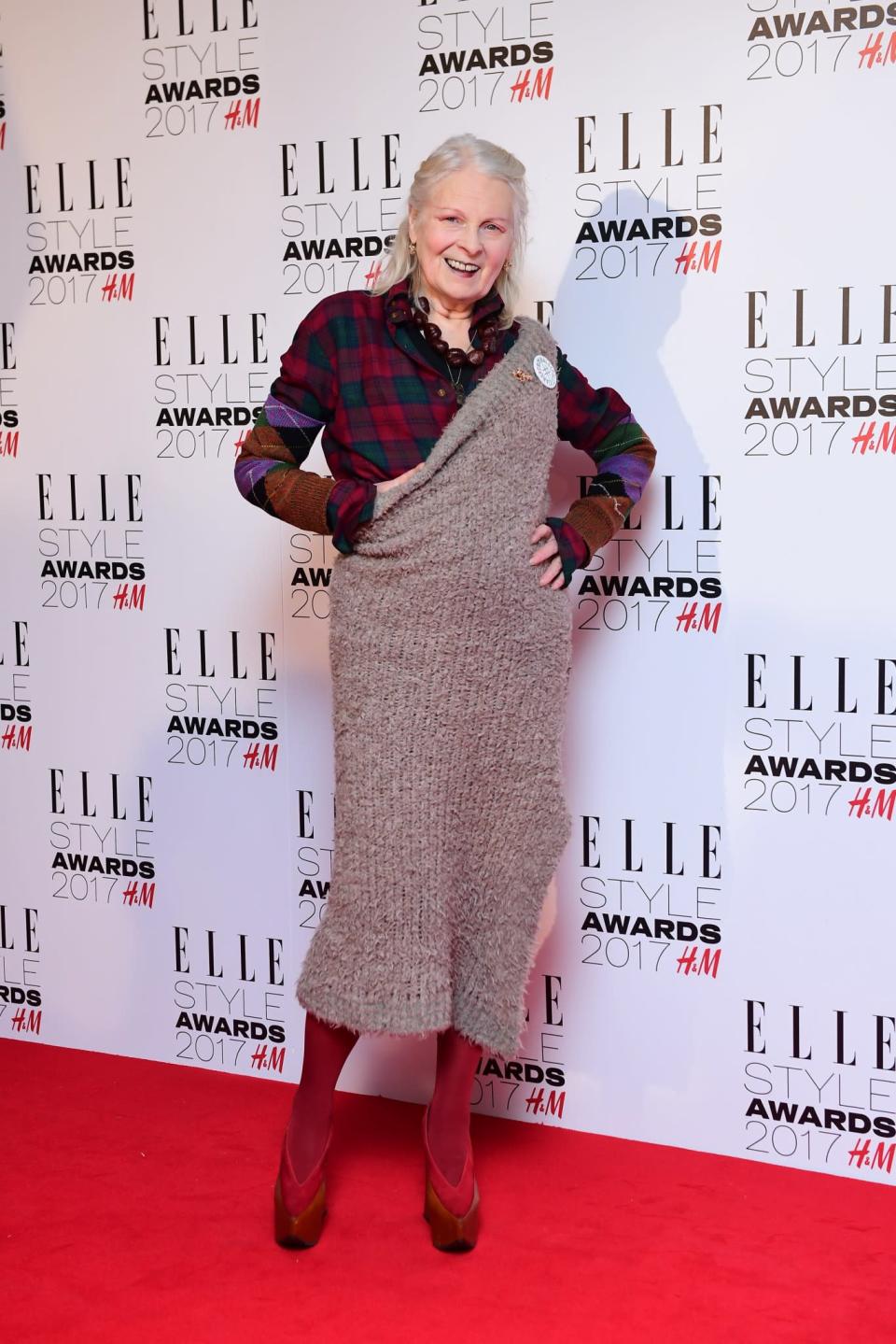 <p>The eccentric designer wore a knitted one-shouldered dress and red platforms by herself, of course. <i>[Photo: PA]</i> </p>