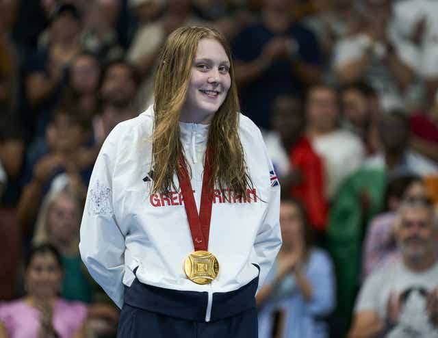 Poppy Maskill on the podium after winning a gold medal