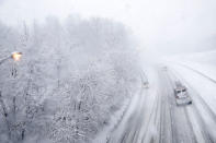 <p>Vehicles travel north over a snow-covered Interstate 287 during a storm on March 7, 2018, in Morristown, N.J. (Photo: Julio Cortez/AP) </p>