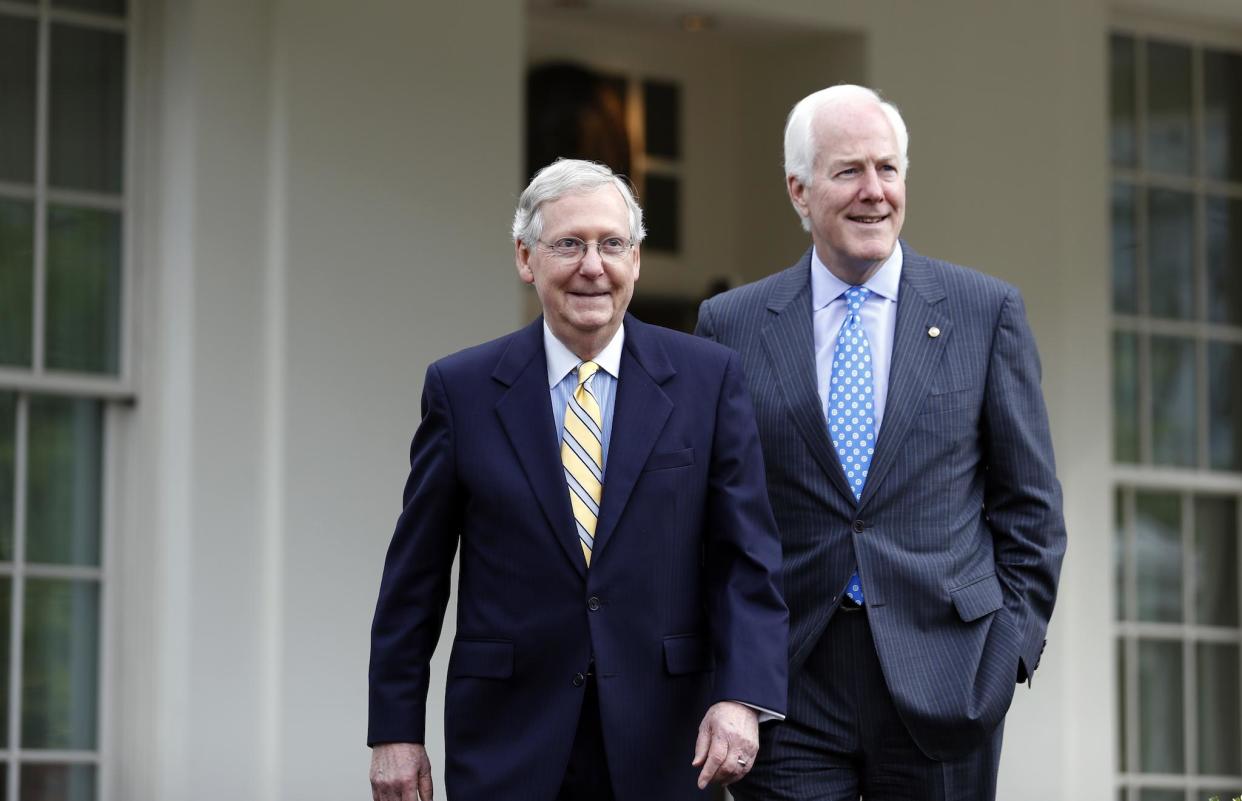 Senate Majority Leader Mitch McConnell and Senate Majority Whip John Cornyn walk to speak with the media after they and other Senate Republicans had a meeting with President Donald Trump at the White House: AP