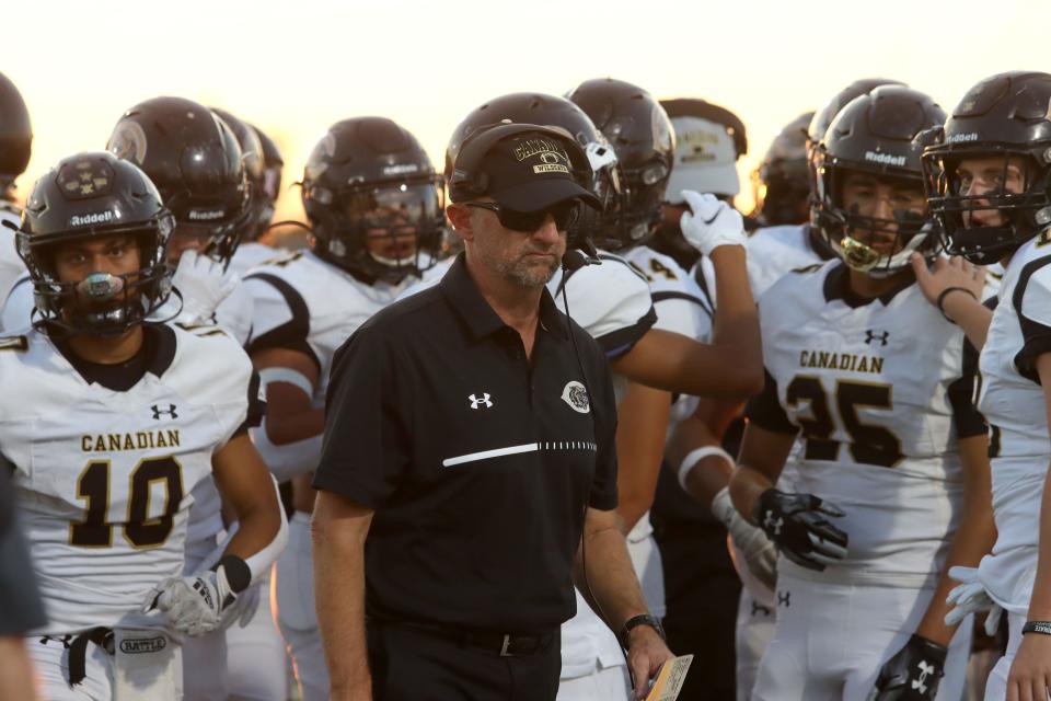 Canadian's head football Chris Koetting stands with his team at the game against Bushland Friday, Sept. 2, 2022, at Falcon Stadium in Bushland. 