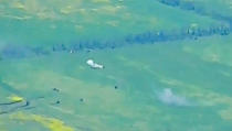 This photo taken from video released by Russian Defense Ministry Press Service on Monday, June 5, 2023, show a Ukrainian military vehicle being hit during a combat in Ukraine. The Russian Defense Ministry said the Russian military fended off an attempt by Ukraine to launch an attack in the southern part of the Donetsk region on Sunday. (Russian Defense Ministry Press Service via AP)